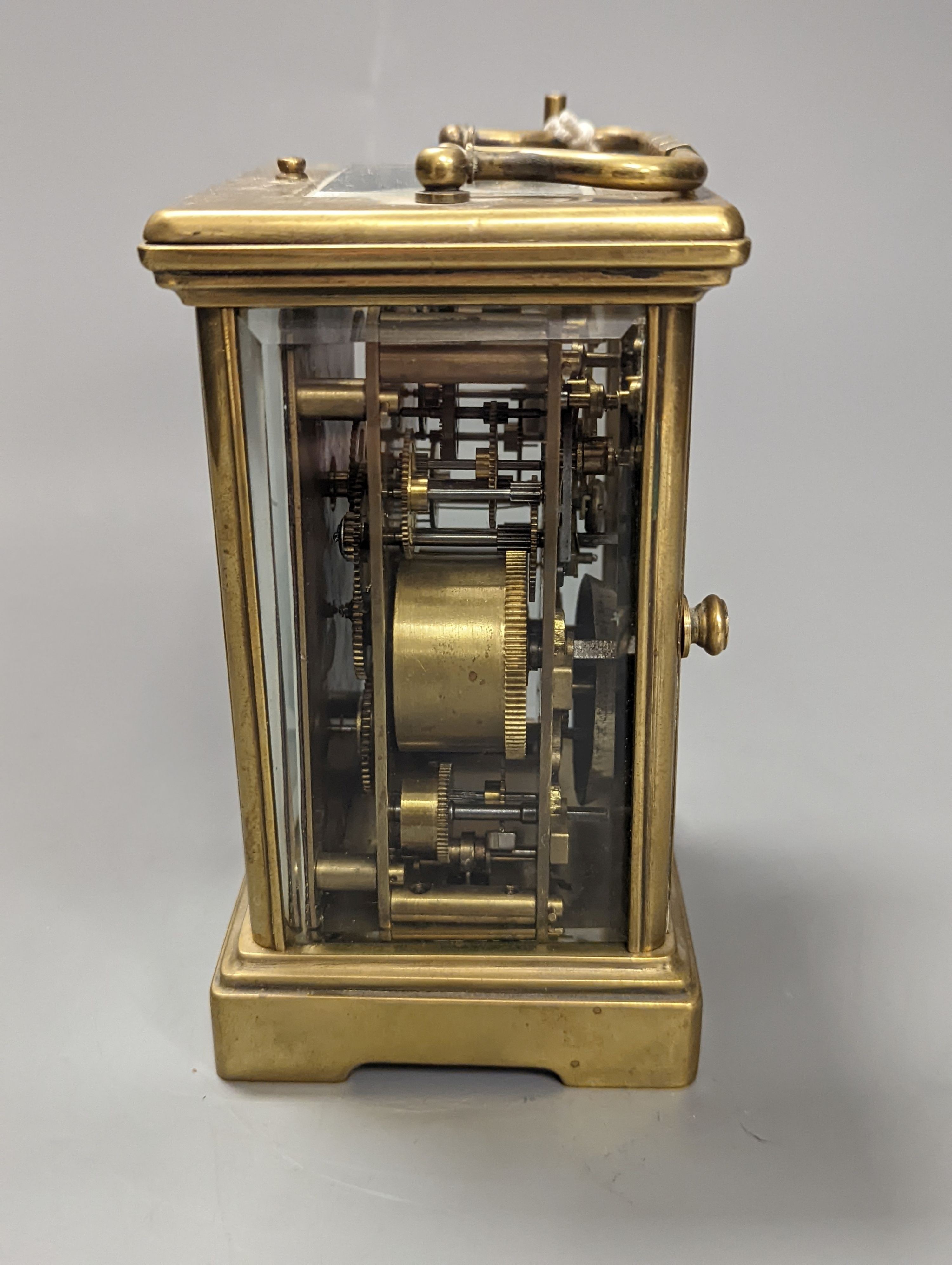 A brass cased carriage clock, with key. 16cm